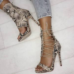 European and American high heel crisscross lace up hollow snake pattern cool boots