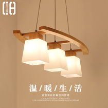 Dining room lights Nordic solid wood chandelier simple modern creative personality three-head dining room table bar log Japanese lamp
