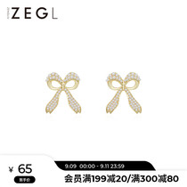 ZEGL French imitation pearl bow earrings female niche design sense ear studs 925 silver needle personality Net red earrings