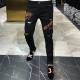 The new trend of men's personality Slim feet black hole in the head drilling hot pants jeans young men The new trend of men's personality Slim feet black hole in the head drilling hot pants jeans young men