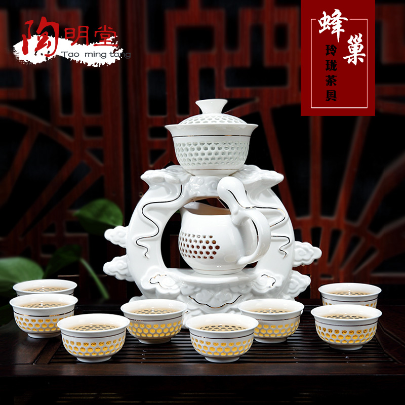 Fully automatic and exquisite tea sets suit household lazy people of blue and white porcelain tea set ceramic creative hollow out of a complete set of kung fu tea set