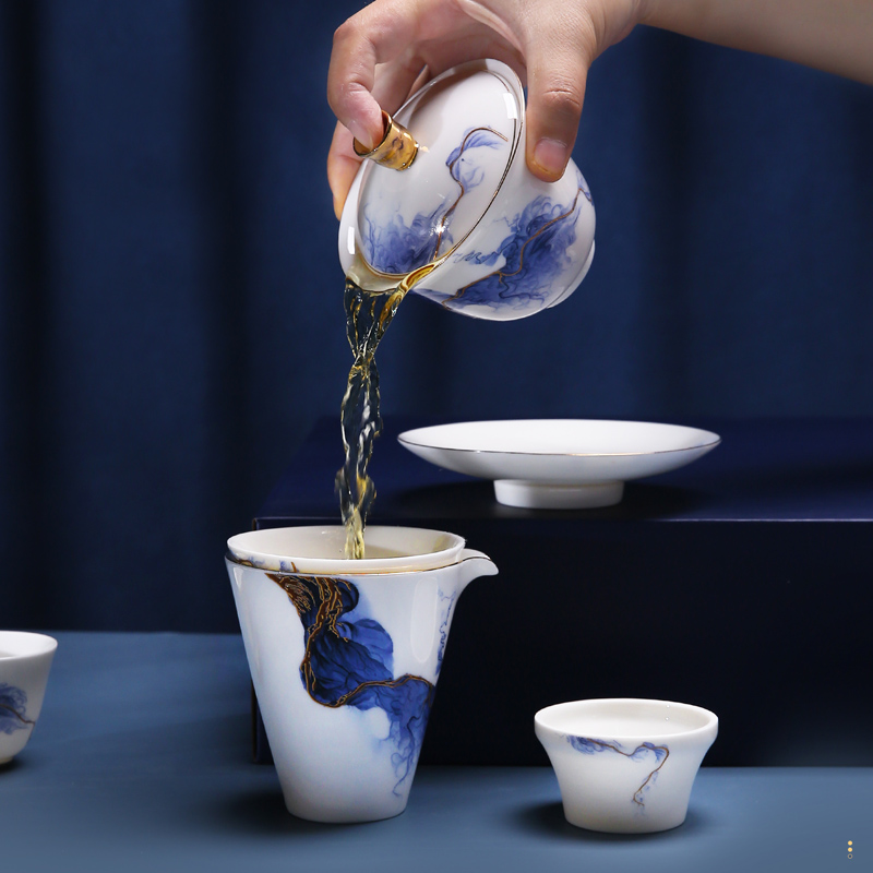 The Poly real scene dehua high - end white porcelain kung fu tea set golden years ink contracted only three tureen gift set