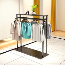 Double row Nakajima frame landing womens clothing store middle display shelf gold parallel bars display clothes rack childrens clothing is hanging