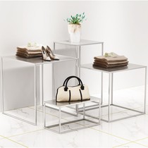 Clothing store window shoes shelf height table set-ups for men and womens clothing store Island showcase bags silver