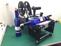 Manual labeling machine self-adhesive label glass bottle labeling round bottle labeling machine small machine factory direct sales
