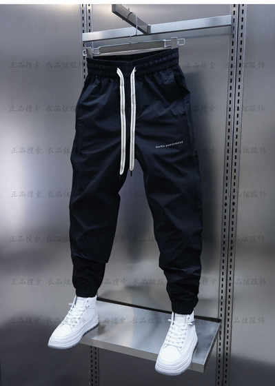 Spring and Autumn Men's casual pants trendy new solid color embroidery tying pants elastic waist slim feet pants men
Spring and Autumn Men's casual pants trendy new solid color embroidery tying pants elastic waist slim feet pants men