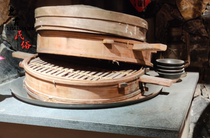 Nostalgic old-fashioned iron pot old cage fan steamed old black bowl steamed bread using old tools folklore display nostalgic old objects