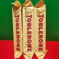 Swiss imported triangle milk chocolate products with honey and Badan sugar 35 grams of snacks on sale