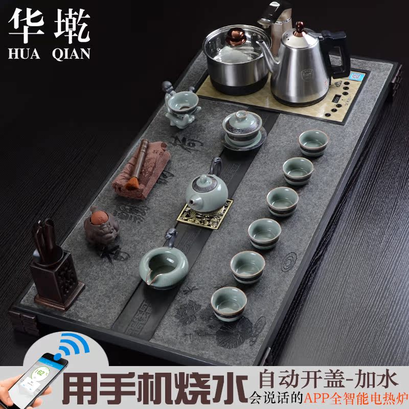 China Qian large sharply black stone tea tray and induction cooker four tea tea sea of a complete set of kung fu tea set