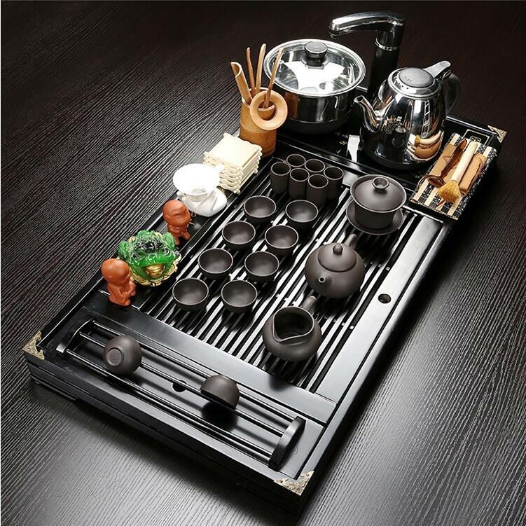 The hutch of a complete set of solid wood tea tray package ceramic kung fu tea tea set household contracted with integrated electric magnetic mixture furnace