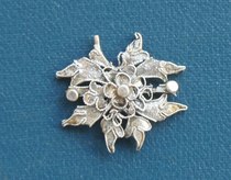 An old silver flower ornament