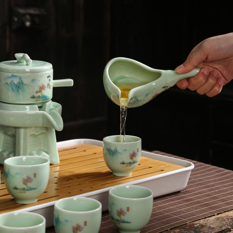 Tea set home stone mill creative ceramic teapot Tea tray was kung fu Tea cup half full automatic lazy