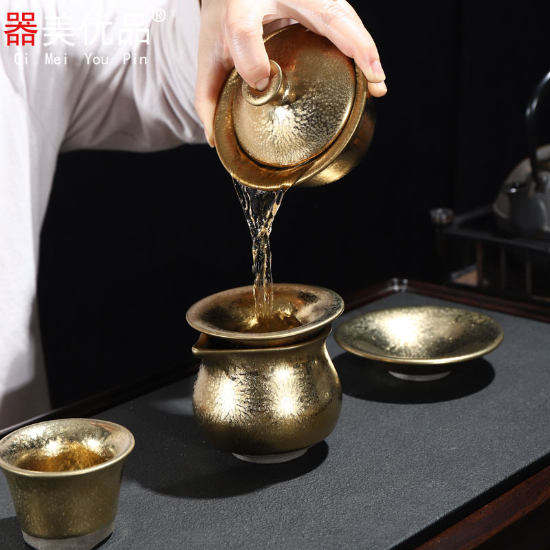 Is the best product of a complete set of kung fu tea sets ceramic drop light gold hand tea tureen teapot household gifts