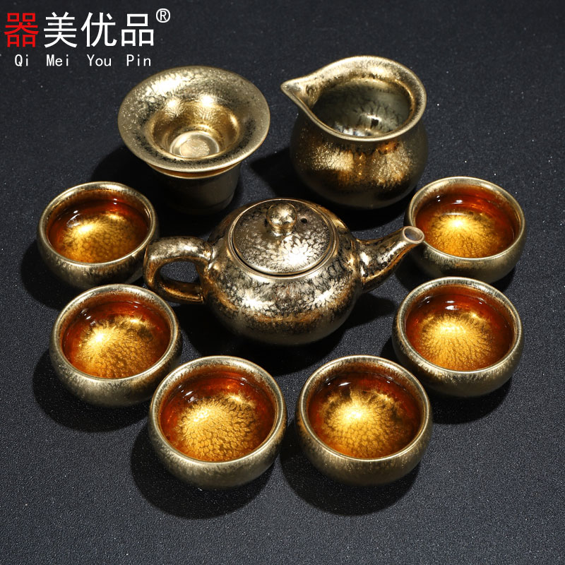 Is the best product of a complete set of kung fu tea sets ceramic drop light gold hand tea tureen teapot household gifts