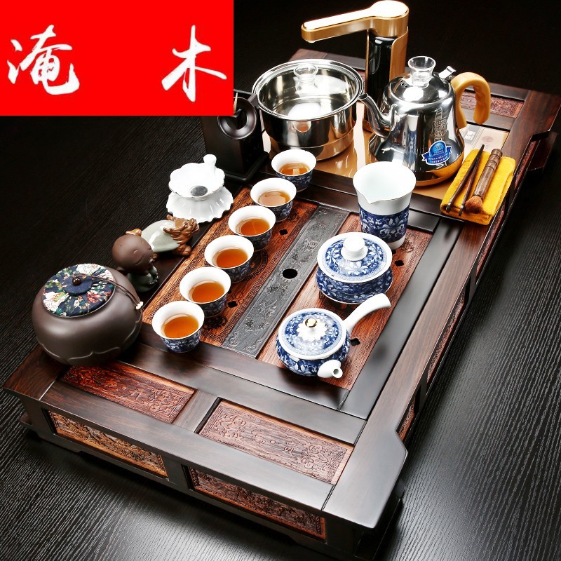 Flooded ebony wood tea tray was violet arenaceous kung fu tea set four unity of a complete set of automatic induction cooker household tea set