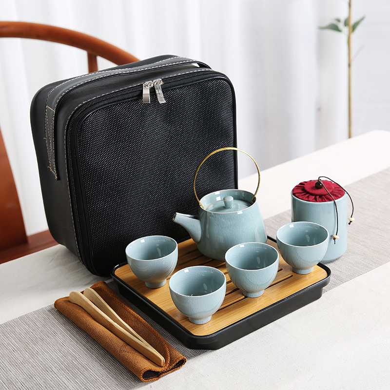 Ceramic is suing travel kung fu tea set suit portable bag contracted with snow a pot of four cups of custom wholesale