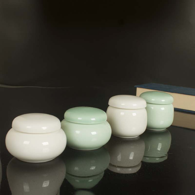 To DE new rotating liquid paste in cream bottle sealed tank small tea pot porcelain ceramic tea pot