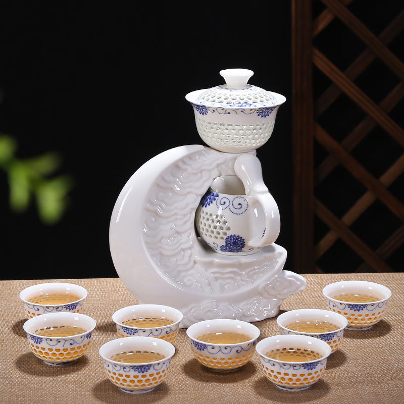 Friends is a complete set of automatic water and exquisite blue and white hollow out tea set suits for against hot insulation teapot