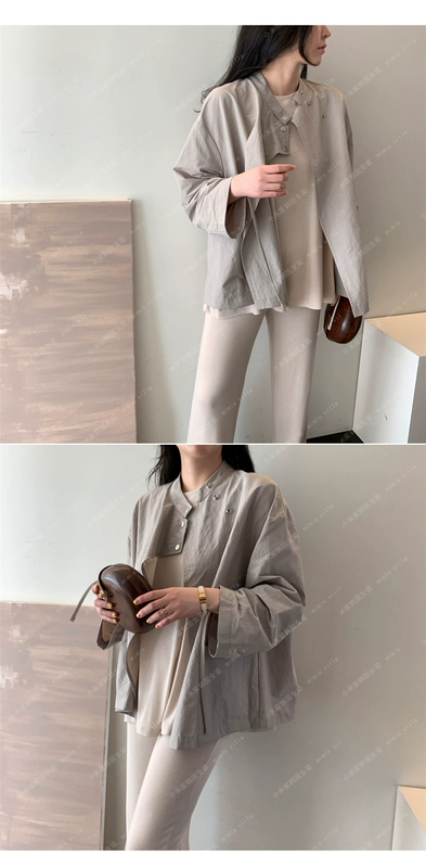 F23 quần áo phụ nữ Hàn Quốc sản phẩm mới 2021 thiết kế lỏng lẻo cảm giác đơn giản mùa xuân và mùa thu áo gió của phụ nữ áo khoác ngắn đi lại tay áo chín điểm - Trench Coat