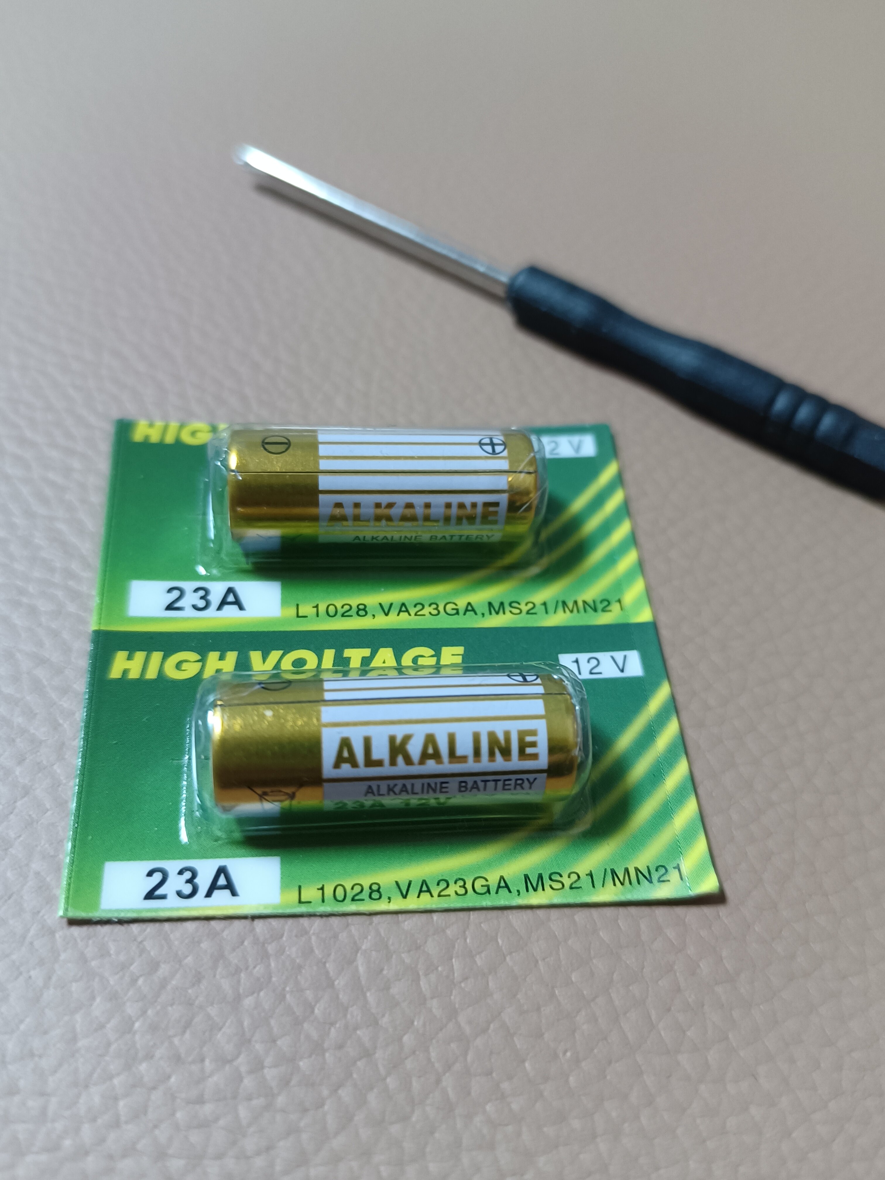 先机电动卷帘门遥控器23a12v电池27a12v红外门铃防盗引