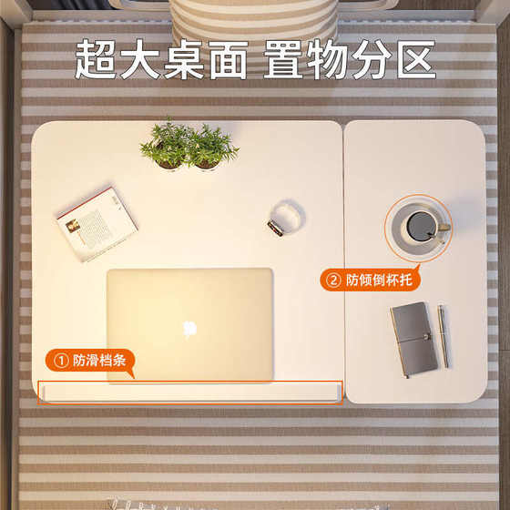 침대의 작은 테이블은 데스크탑 접이식 데스크를 들어 올릴 수 있습니다 침대의 작은 테이블은 데스크탑 접이식 데스크를 들어 올릴 수 있습니다