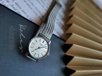 Grid pattern dial round all-steel quartz womens watch