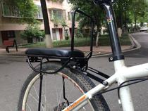 Bicycle rear frame with door armrests and soft cushions. The rear seat carries people and cargo off-road to Lhasa.
