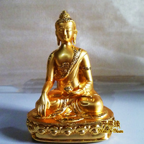 Sakyamuni the gold-plated statuette of Sakyamuni carries three treasures with him