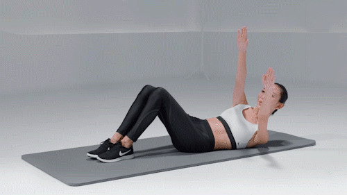 去购买 去购买  ——  卷腹转体 仰卧于垫上,双臂向上伸直,下颚收至