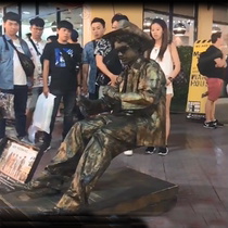 Lean forward lean back headless person human body tilt suspension performance art copper man shaking voice net red toy game props