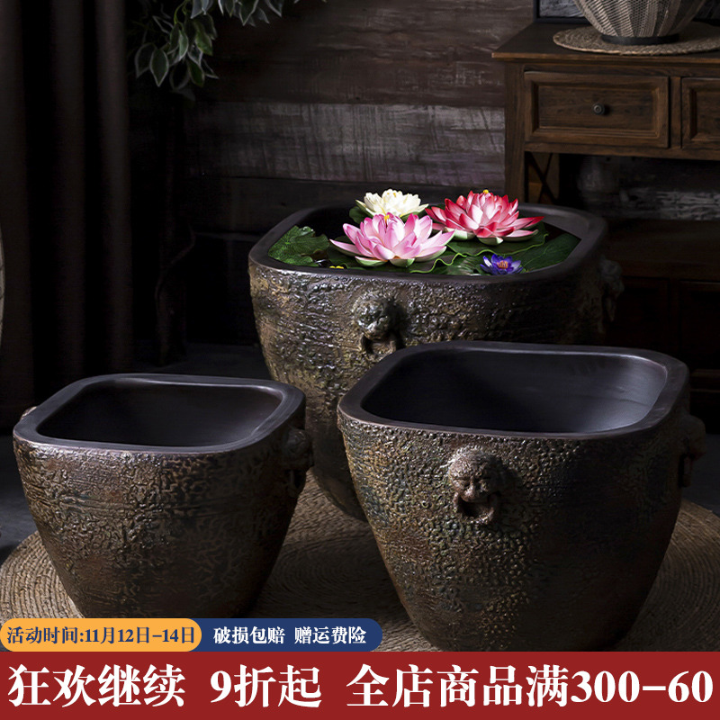 Fish tank old water household ceramics tile cylinder coarse pottery basin water lily lotus is suing landscape garden plant trees