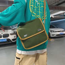 One-shoulder school bag male student oblique canvas bag Hong Kong style couple backpack Korean version of the campus wild mailman bag oblique cross bag