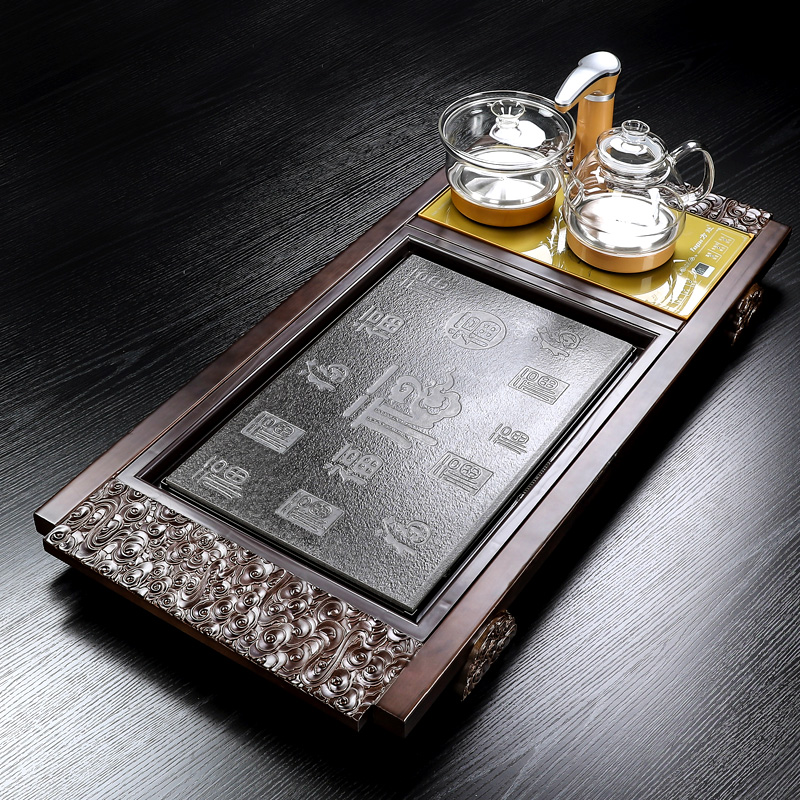 In building a complete set of solid wood tea tray automatic kung fu tea set household water induction cooker tea sea