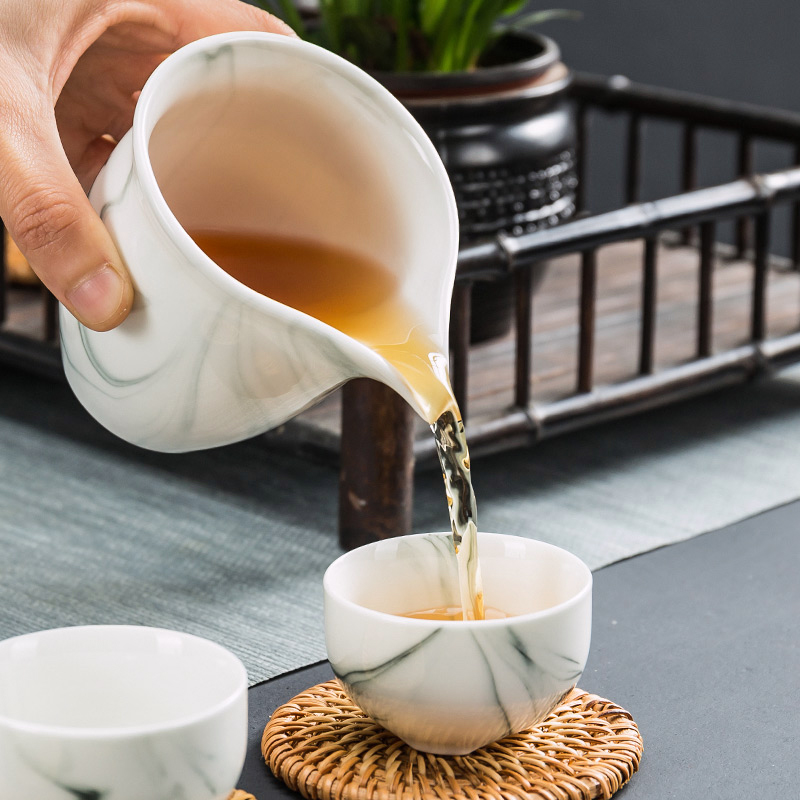 Building In hand - made kung fu tea set household contracted blue and white porcelain ceramic dehua white porcelain tea set. A complete set of tea cups