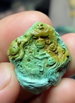 Turquoise playful craft carved death pendant...