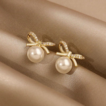 Bow Tie small and delicate pearl earbuds brief temperament female net red 2022 new wave earrings 925 silver
