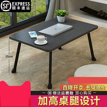 The folding table where the elderly can eat on the bed. The dining table that can be used by the students.