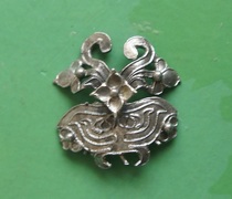 An old silver flower ornament