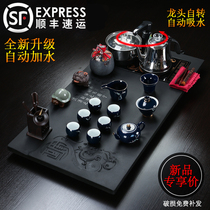 Natural black gold stone tea set set Automatic induction cooker Kung Fu tea set four-in-one household set of stone tea table