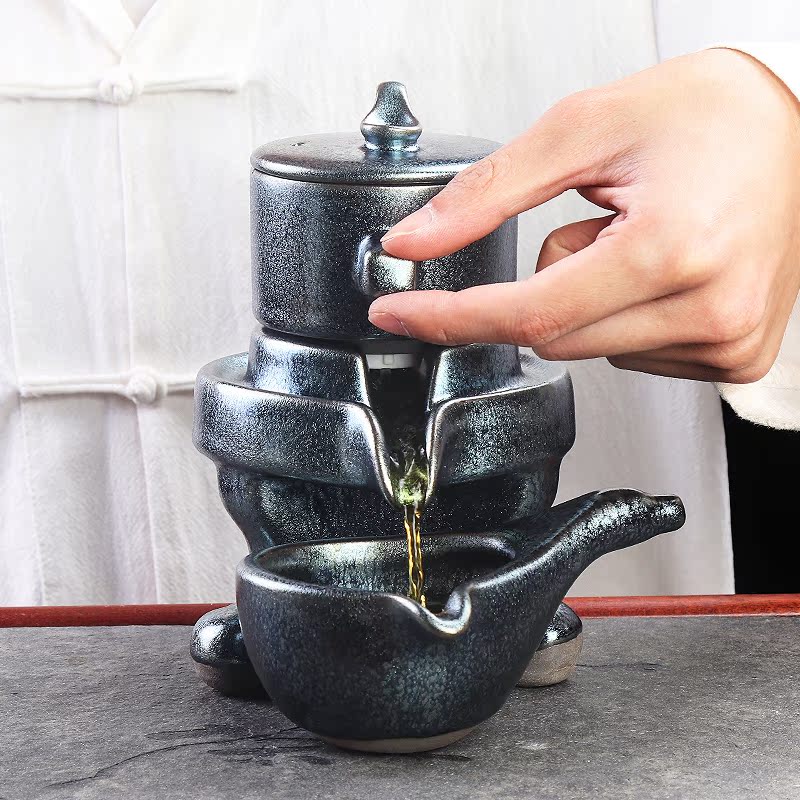 Artisan fairy built one lazy stone mill tea set suit household kung fu tea tea tray of a complete set of automatic ceramic tea set