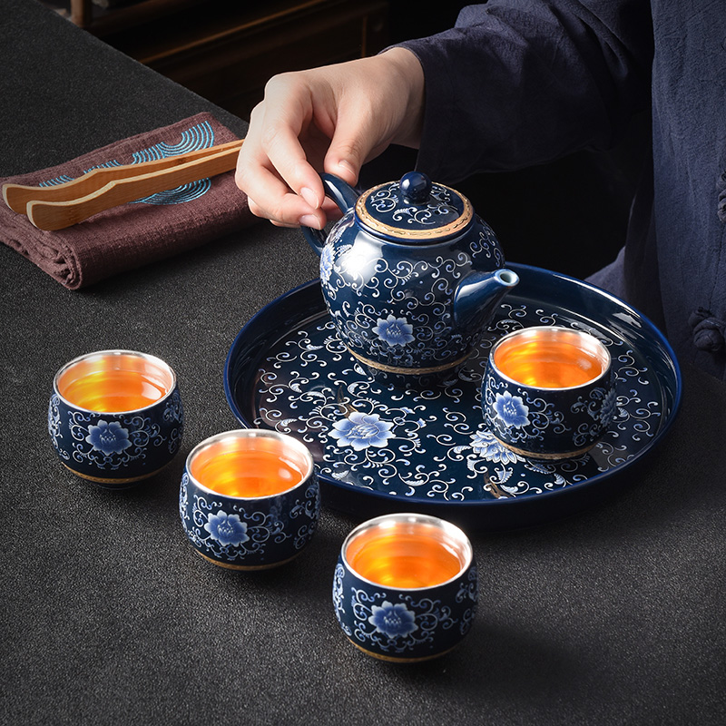 Jingdezhen household kung fu tea tea set tea service office to receive a visitor a small set of pot of four cups coppering. As silver tea set