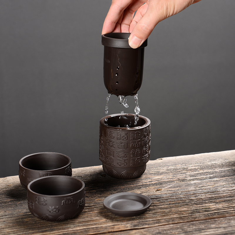 Portable travel kung fu tea set ceramic filter a pot of tea cup four cups of Japanese creative individual cup one cup