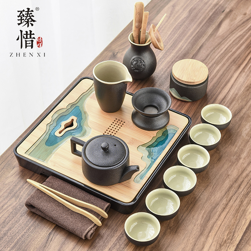 By understanding the modern black ceramic kung fu tea set household contracted mini Japanese tea tea tray of a complete set of the teapot