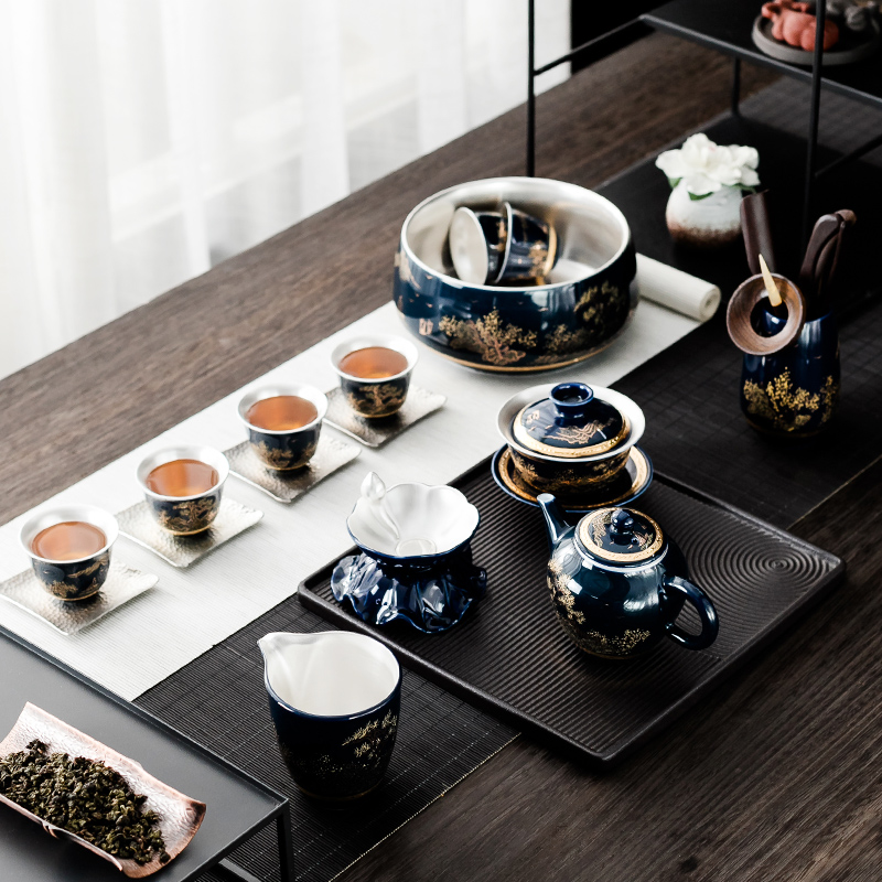 NiuRenLiu silver kung fu tea set suit household teapot teacup of blue and white porcelain ceramic office gift of a complete set of tea sets