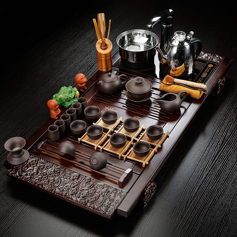 Back on solid wood tea tray was four unity of household ceramic kung fu tea set of a complete set of automatic tea set