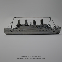 Clockwork boring a piece of the Titanic playing the 3D metal puzzle.