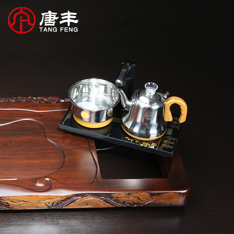 Tang Feng upset the whole board half manual edge carving large ebony wood tea table ground automatic water heating furnace z