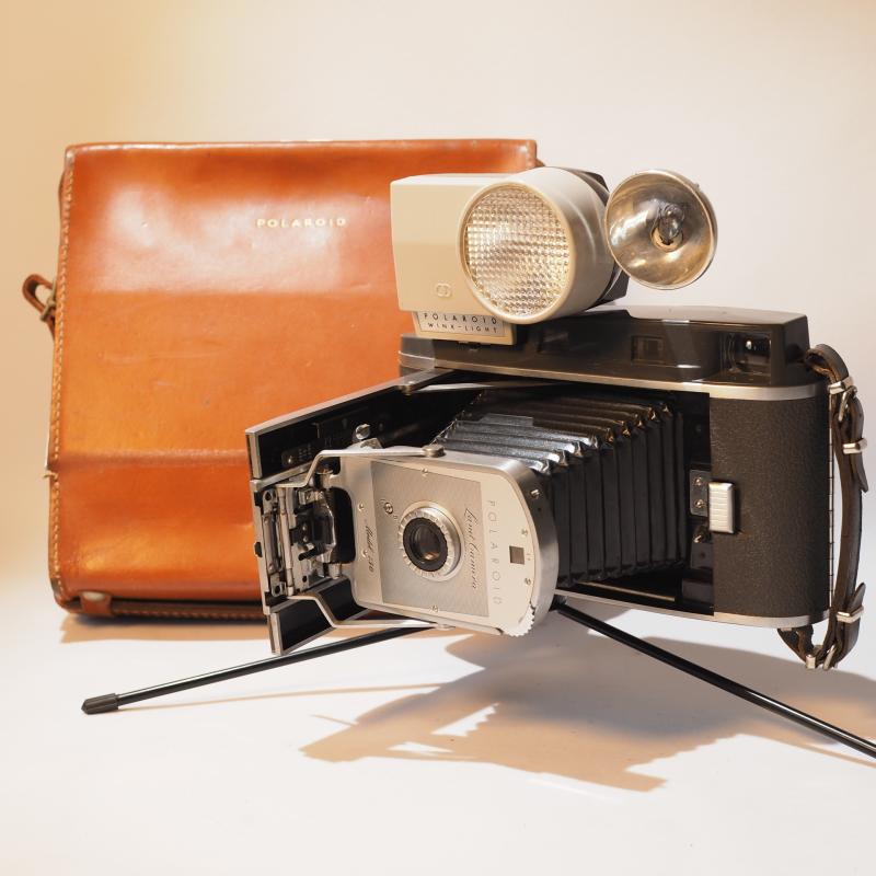 Nostalgia old object Polaroid 150 camera with flash band box