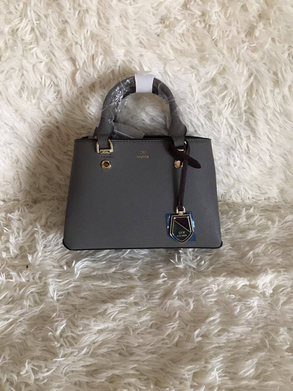 lyn 吊饰金属手提单肩包新款女包_7折现价214.57元