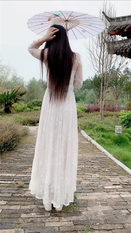 Dấu chân của Nữ hoàng Trang chủ Siêu cổ tích Váy dài trắng Váy ren móc hoa rỗng Quần áo phụ nữ - Váy dài